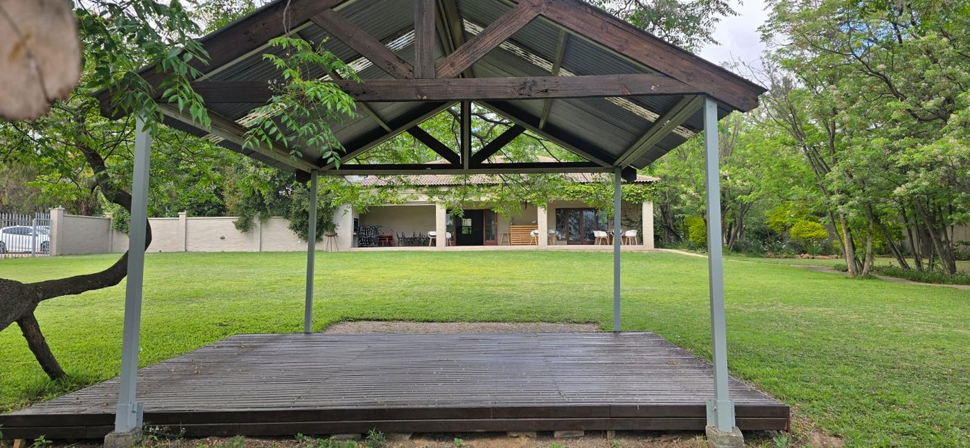 Covered wooden deck stage on the lawn